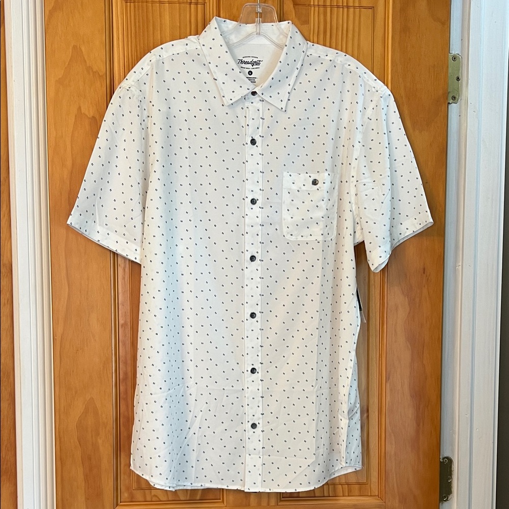 White shirt w cute dotted design. Could be black or navy: too small to tell